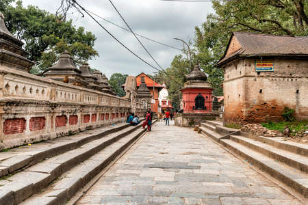 Kathmandu, Nepal - Oct 12, 2018: Tourists walking on the hill above Pashupatinath temple in Kathmandu,Nepalのeditorial素材