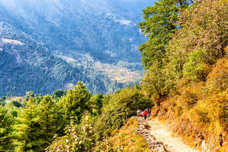 Phakding, Nepal - Oct 25, 2018: Trekkers on the trail to Phakding village on the Everest base camp trek, Sagarmatha National Park, Khumbu region, Nepal.のeditorial素材