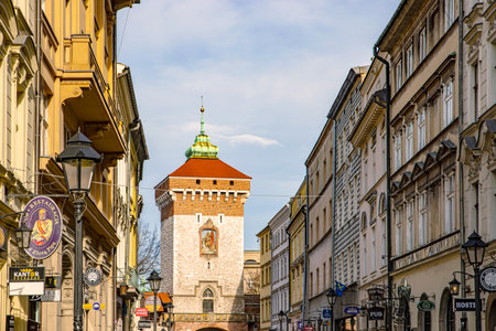 Cracow, Poland â Feb 02, 2019: View at Medieval tower with entrance Gate to Florianska street in the Old Town section of Cracow, Poland UNESCO world Heritage side.のeditorial素材