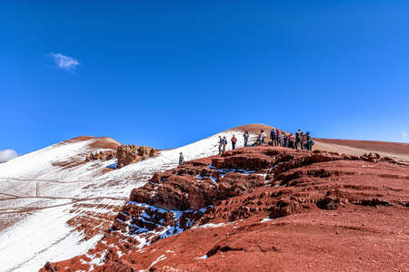 Cusco, Peru - April 10, 2019: Tourists on the trek route in Vinicunca, Cusco Region, Peru. Trekking from Rainbow mountain to Red Valley.のeditorial素材