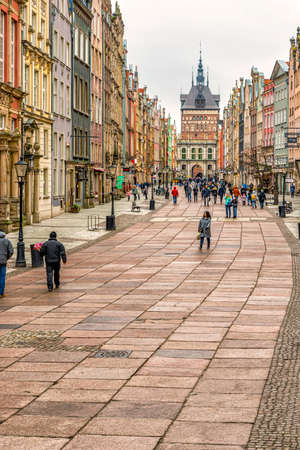 Gdansk, Poland â Feb 14, 2019: View at the historic Long street called Dluga in city of Gdansk, the Golden Gate and the old Prison tower now Amber Museum at the background.のeditorial素材
