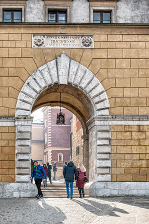 Cracow, Poland Feb 03, 2019: Tourists entering main gate to Royal Castle area, and Wawel cathedral in Cracow, UNESCO World Heritage Site, Poland, Europeのeditorial素材