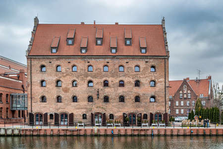 Gdansk, Poland â Feb 14, 2019: View at historic houses along Motlawa river in the old historic town of the Gdansk city in Poland. It is one of many tourist attractions.のeditorial素材