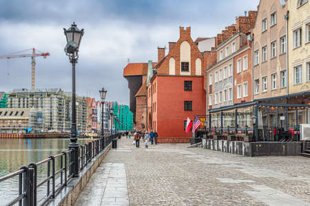 Gdansk, Poland â Feb 14, 2019: The classic view of Gdansk with the historic Gdansk Crane and the Hanseatic-style buildings along River Motlawa, Poland.のeditorial素材