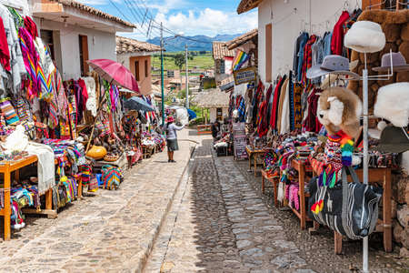 Chinchero, Peru â April 4, 2019: Vendors selling local textile products and souvenirs on the street of Chinchero, a small town of Urubamba Province in Peru.のeditorial素材