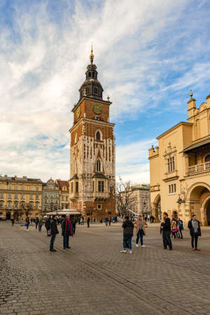 Cracow, Poland - Feb 2, 2019: Tourists visiting Main Market Square and Town Hall Tower in Cracow, Polandのeditorial素材