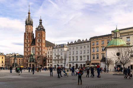 Cracow, Poland - Feb 02, 2019: View at the historic St Mary's Church located on Main square, Rynek Glowny, in Cracow, Poland.のeditorial素材