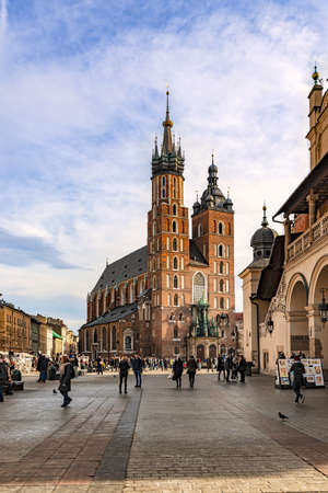 Cracow, Poland - Feb 02, 2019: View at the historic St Mary's Church located on Main square, Rynek Glowny, in Cracow, Poland.のeditorial素材