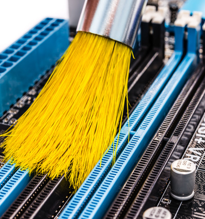 Cleaning of the computer with brushの写真素材
