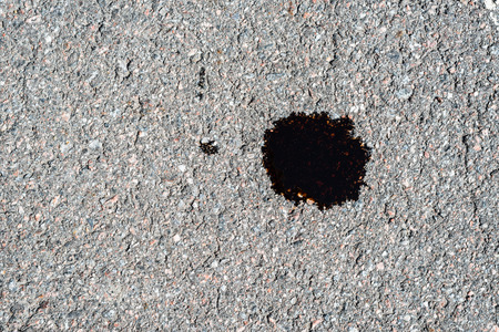 Oil leak on the asphaltの写真素材
