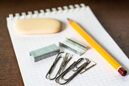 Pencil and a clips on the notebookの写真素材