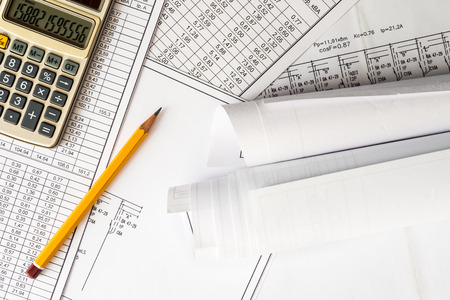 Rolls of drawings, calculate and record the results of calculationsの写真素材