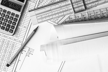 Rolls of drawings, calculate and record the results of calculations. In black and white tonesの写真素材