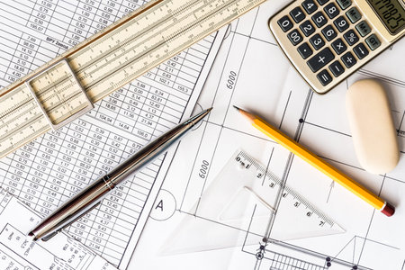 Schemes on the table, draw a pencil, draw a ruler and calculator count
