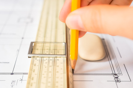 Hand holds the pencil to create a drawing. Angle viewの写真素材