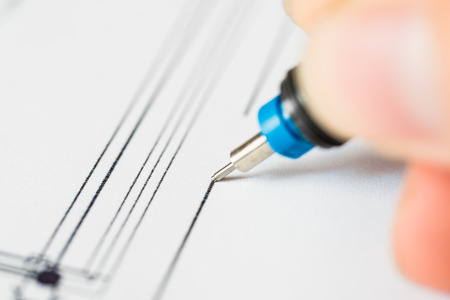 Drawings with pen for draw hold hand. Angle view close-upの写真素材