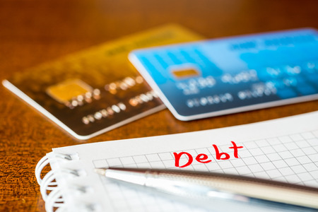 Debt payments, the calculation of the balance, a credit cards on the tableの写真素材