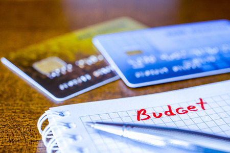 Cash budget, the calculation of the balance, a credit cards on the table. In blue tonesの写真素材
