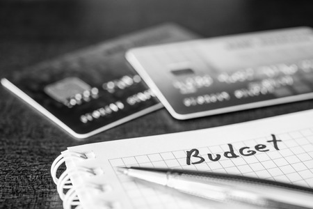 Cash budget, the calculation of the balance, a credit cards on the table. In black and white tonesの写真素材