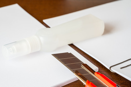 Stationery on the desk in the office, a knife on the paper with a glueの写真素材