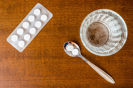 Cure the disease, take the pills in the spoonの写真素材