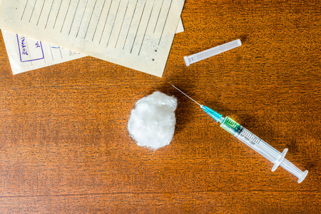 Cure the disease, syringe injection and prescriptions from the doctor on the tableの写真素材
