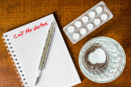 Call the doctor couple of tablets dissolved at a temperature of the glass of water. Focus on the glass of waterの写真素材