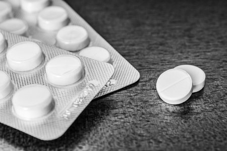 Cure the disease take the pills on the table. Angle view