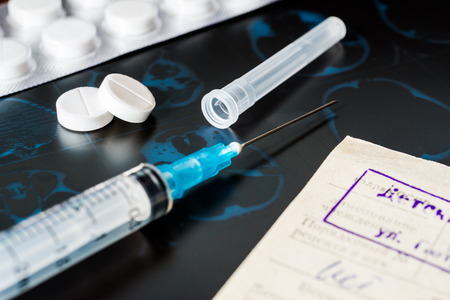 Xray examination prescribing treatment syringe for injection and a two pills for treatment of diseaseの写真素材