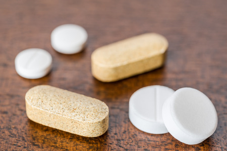 Cure the disease take the pills and vitamins on the table. Angle viewの写真素材