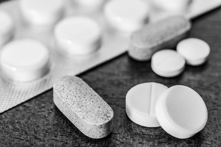 Cure the disease take the pills and vitamins on the table. Angle viewの写真素材