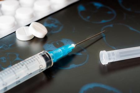 X-ray examination, syringe for injection, a two pills for treatment of diseaseの写真素材