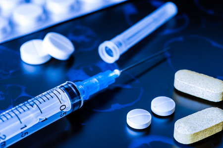 X-ray examination, syringe for injection, a vitamins and pills for treatment of diseaseの写真素材