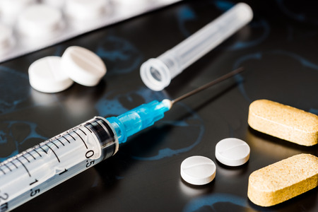 X-ray examination, syringe for injection, a vitamins and pills for treatment of diseaseの写真素材
