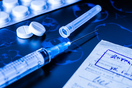 X-ray examination, prescribing treatment, syringe for injection and a two pills for treatment of diseaseの写真素材