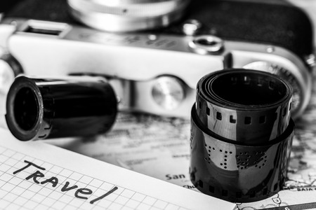 Vacation planning, camera and map of the area on the tableの写真素材