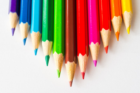 Pyramid of the colored pencils on paperの写真素材