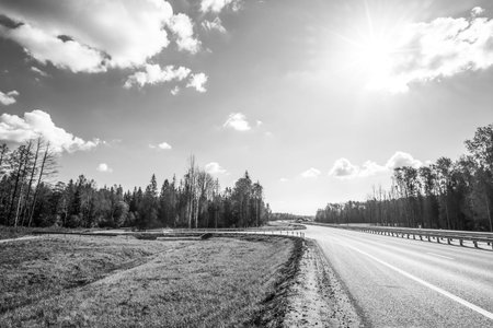 Midday sun on country roads. In black and white tonesの写真素材
