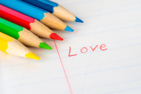 Word love written in a notebook with colored pencilsの写真素材