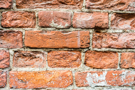 Destroyed the old red brick wall, close up viewの写真素材