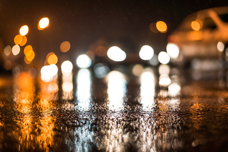 City night headlights, car rides at the rain through the night cityの写真素材