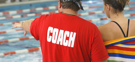 A swimming coach with his student.                 の写真素材