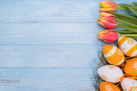 Easter eggs with Tulips on wooden backgroundの写真素材