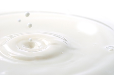 Macro shot of splashing milk droplets. の写真素材