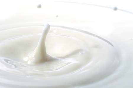 Macro shot of splashing milk droplets. の写真素材