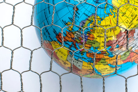 the global map behind a wire fence