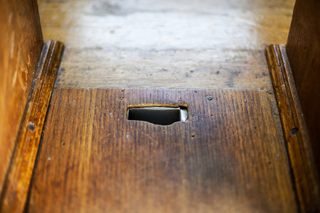 wooden money receiver in a orthodox Greek churchの写真素材
