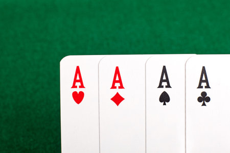 Four aces on green table.の写真素材