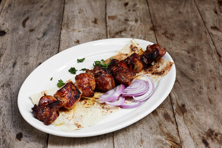 Grilled porkon spit with onions.の写真素材