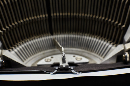 Closeup of old typewriter plates strikers with letters and symbols for typing.